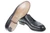 High quality black full grain leather wing tip shoe bottom view showing leather sole and stacked heel construction - Saddleback Leather