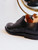 High quality close-up of black full grain leather wing tip shoe heel cup, ankle opening, and quarter brogue stitching - Saddleback Leather
