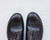 High quality black full grain leather wing tip shoes overhead close-up of wing tip medallion and brogue perforations - Saddleback Leather