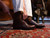 High quality dark oak full grain leather toe cap shoes lifestyle shot with vintage shoehorn on oriental rug - Saddleback Leather