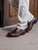 High quality dark oak full grain leather toe cap shoes standing three-quarter view on stone floor - Saddleback Leather