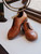 High quality tan full grain leather toe cap shoes three-quarter front studio shot with decorative mirror - Saddleback Leather