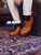 High quality tan full grain leather toe cap shoes side profile lifestyle shot on patterned rug - Saddleback Leather