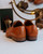 High quality tan full grain leather toe cap shoes rear heel view showing stacked leather heels and stitching - Saddleback Leather
