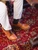 High quality tan full grain leather toe cap shoes top-down on-foot view on red Persian rug - Saddleback Leather