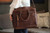 High quality full grain leather Suzette's Steals Women's Business Satchel - Dark Coffee detail view - Saddleback Leather