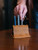 High quality full grain light brown leather Pen Holder Bell Curve front view - Saddleback Leather