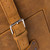 High quality leather trunk that will be a vintage antique one day in a museum. This is the a buckle and strap. It is a tan brown steamer trunk that was old time luggage back in the day on trains and ships.