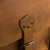 High quality leather trunk that will be a vintage antique one day in a museum. This is the strap and where it closes on it.. It is a tan brown steamer trunk that was old time luggage back in the day on trains and ships.