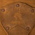 High quality leather trunk that will be a vintage antique one day in a museum. This is the logo, kind of a family crest. It is a tan brown steamer trunk that was old time luggage back in the day on trains and ships.
