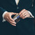 High quality man holding a thin leather wallet.