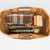 High quality tan brown leather duffle bag wide open to hold overnight travel gear.