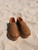 High quality lifestyle image of the barefoot slip on shoe