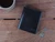 High quality lifestyle image of the Silverback Large Bifold leather Wallet in black