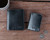 High quality lifestyle image of the Silverback Large Bifold leather Wallet in black