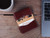 High quality lifestyle image of the slim business card leather holder in Italian reddish brown