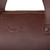 High quality up close look at the logo in red brown