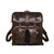 High quality dark brown big mouth leather backpack from the front. Gladstone closure for the main pocket and both front pockets. Made by Saddleback