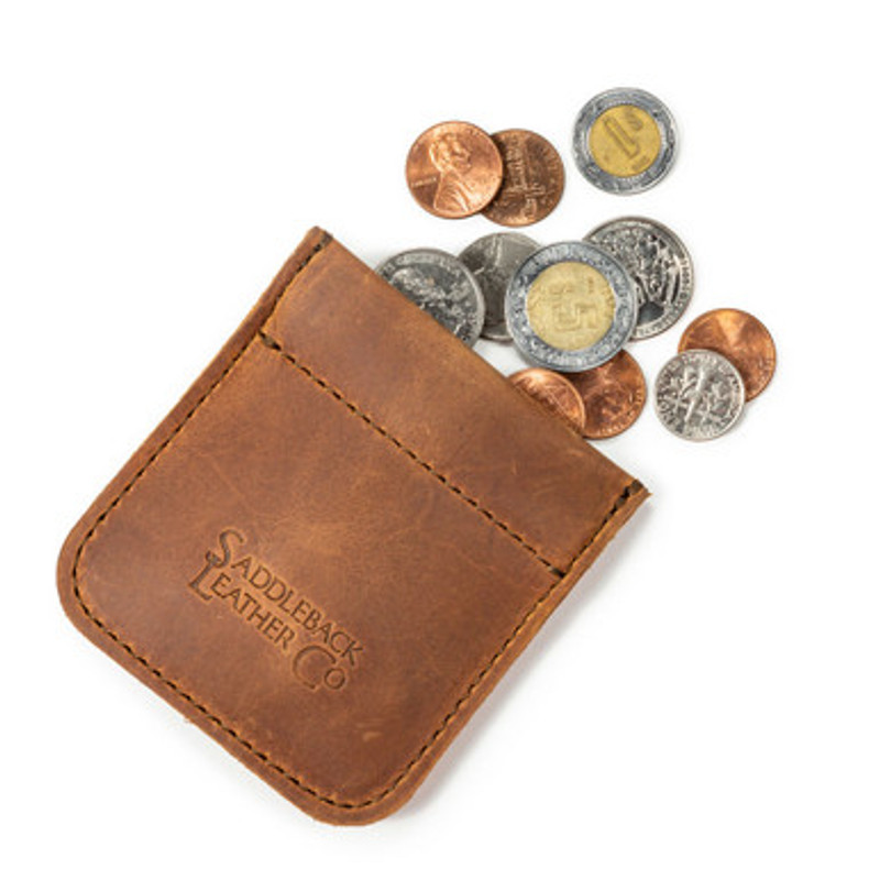 This is the front of a tan brown leather coin purse used for change that a man is holding.