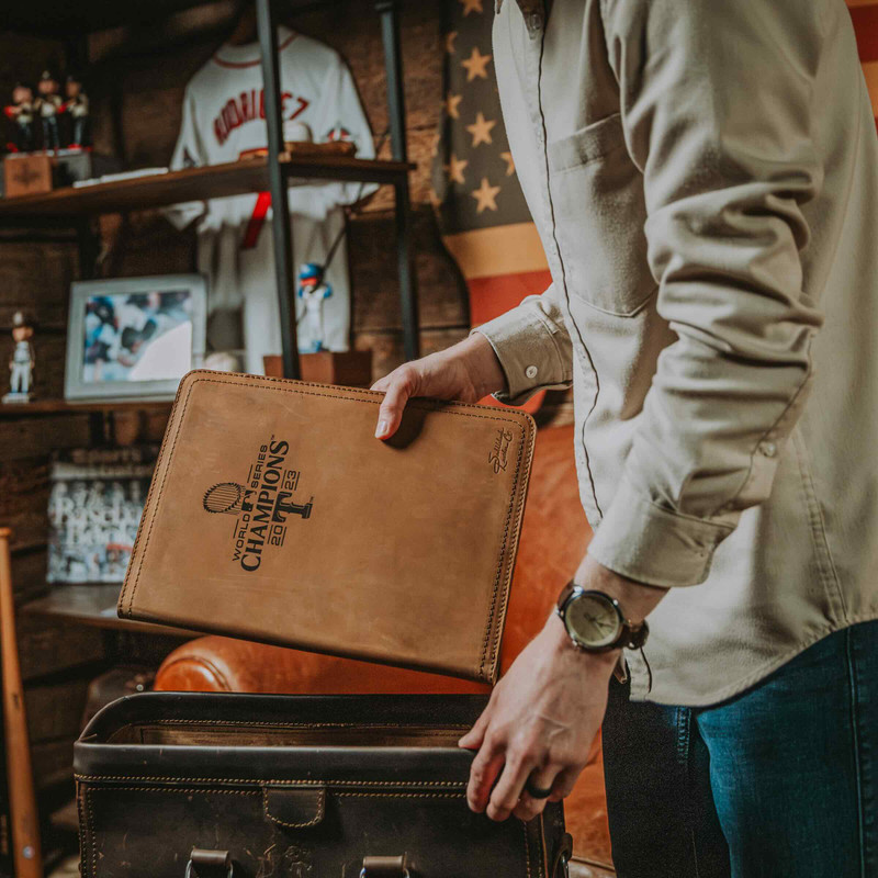 Capture your thoughts and showcase your team allegiance with this Texas Rangers World Series notepad portfolio from Saddleback, a must-have for fans and professionals alike.