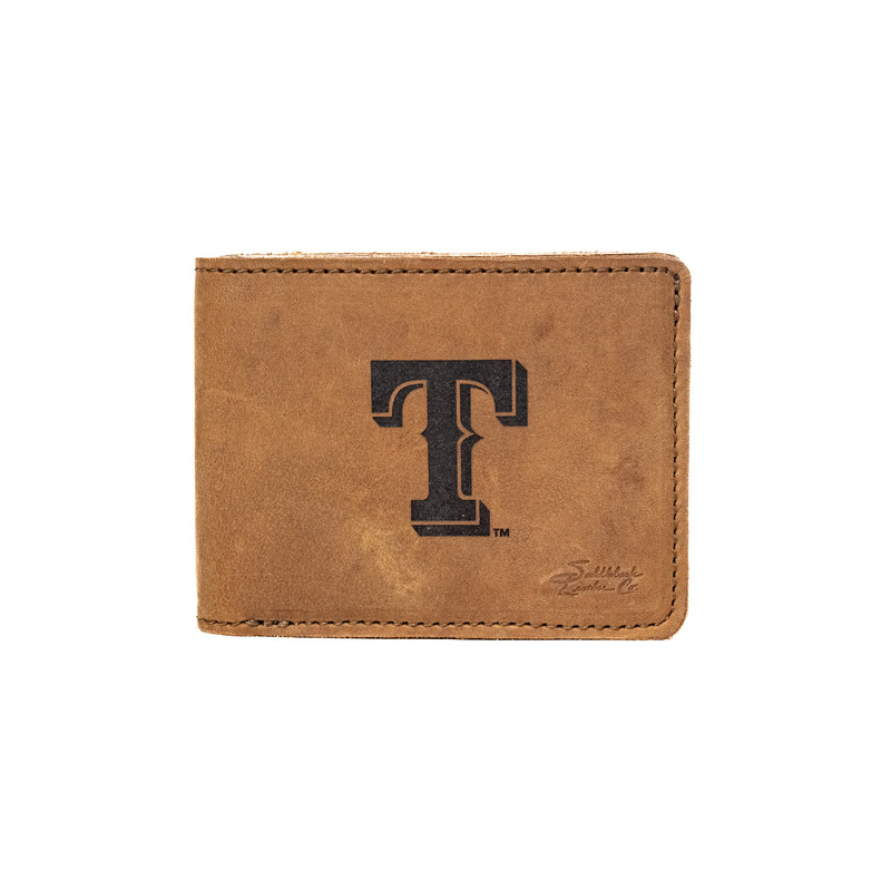 This exclusive Texas Rangers bifold wallet, crafted from premium saddleback leather, is the ideal companion for any fan. Featuring a built-in RFID blocker, ample storage for cards and cash, and a 100-year warranty, it's designed to celebrate your team in style and with security.