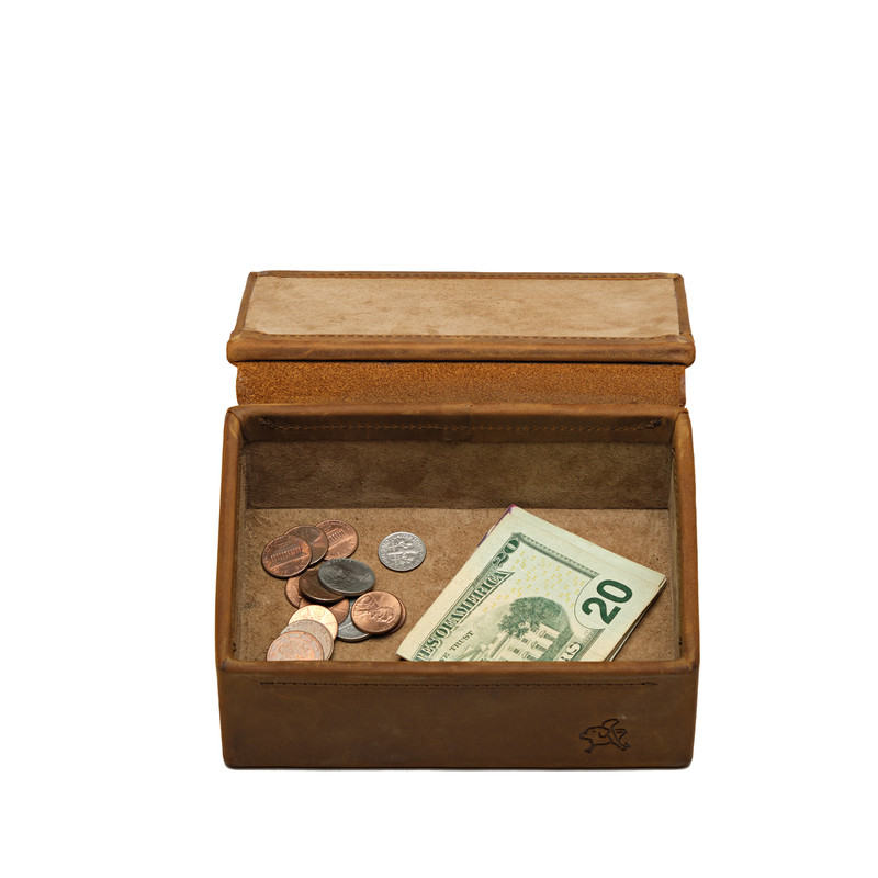 High quality opened tan small leather organizer box that is holding money. Made by Saddleback