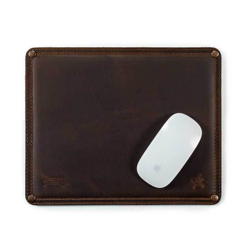 High quality dark brown leather mouse pad with a mouse on it. It has stitching around the edges and neoprene in the middle.