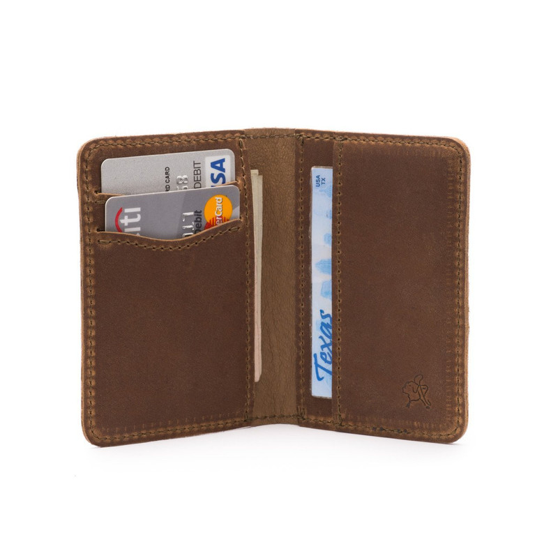 This is a thin tan brown leather wallet that folds in the middle wide open..