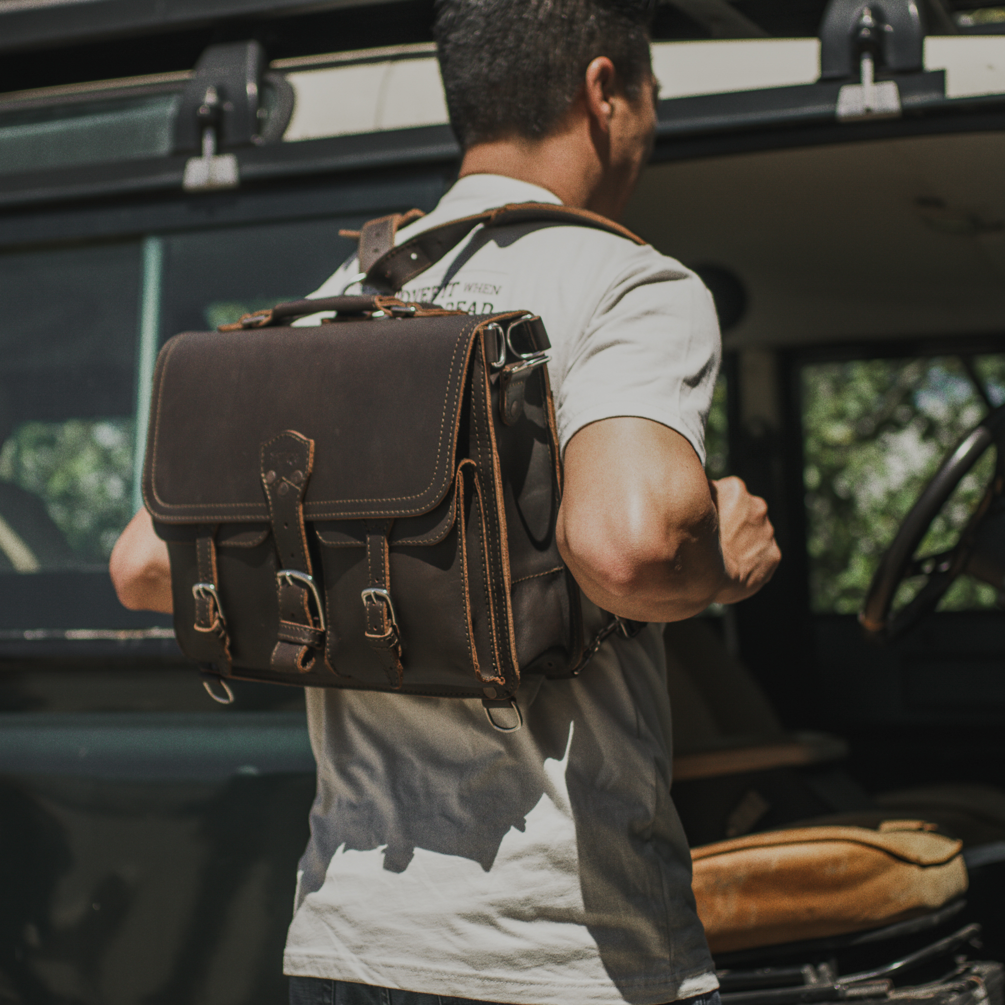A leather briefcase backpack in dark brown leather.