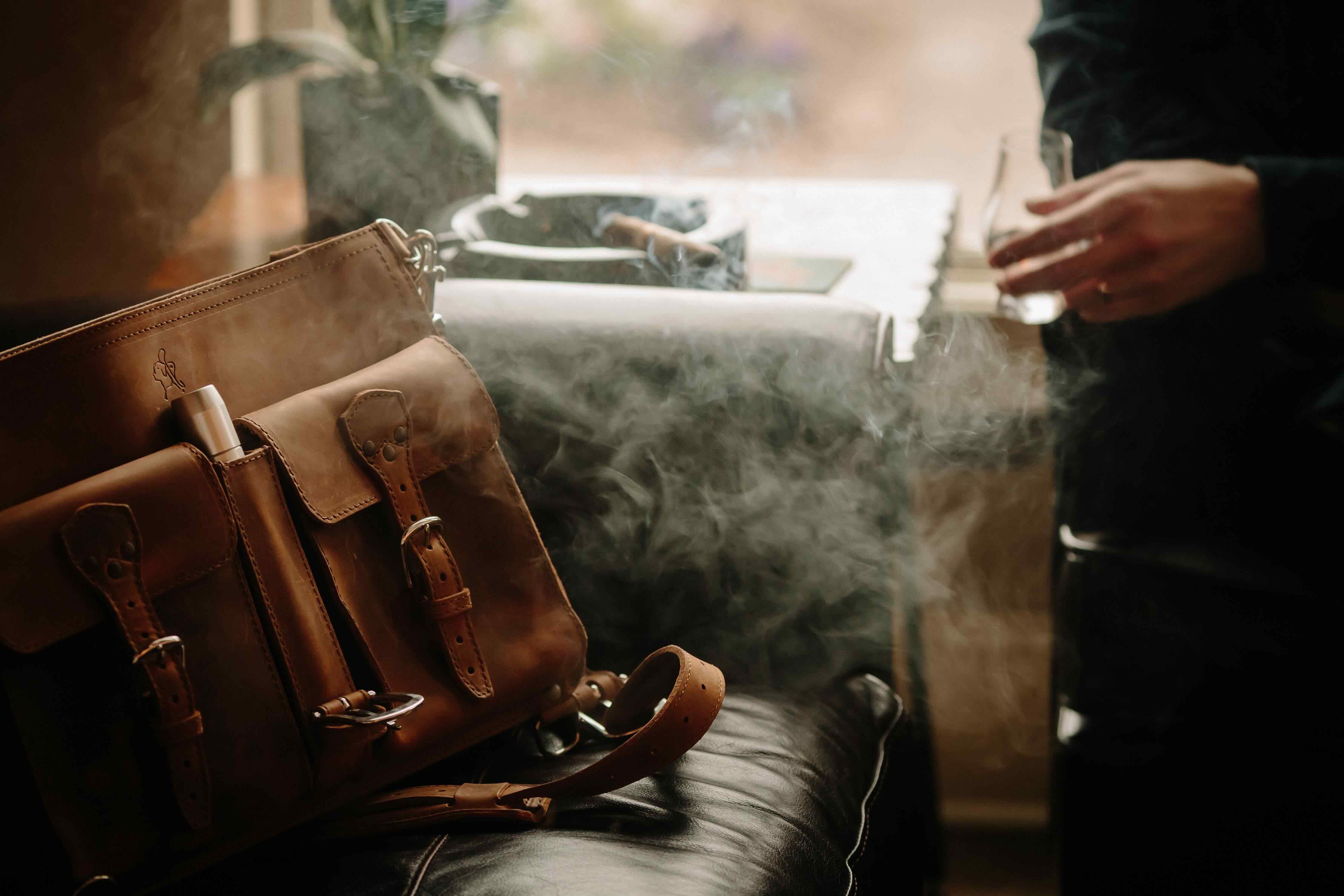 Leather briefcase with cigar holder.