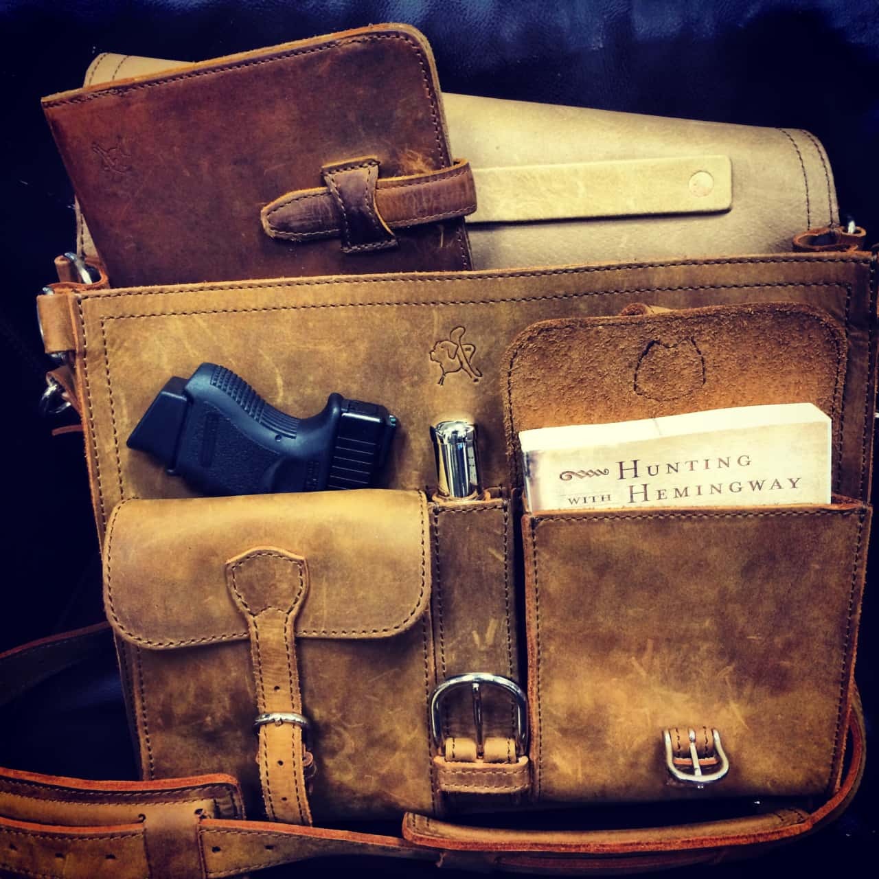 A thin briefcase with front pockets by Saddleback Leather.