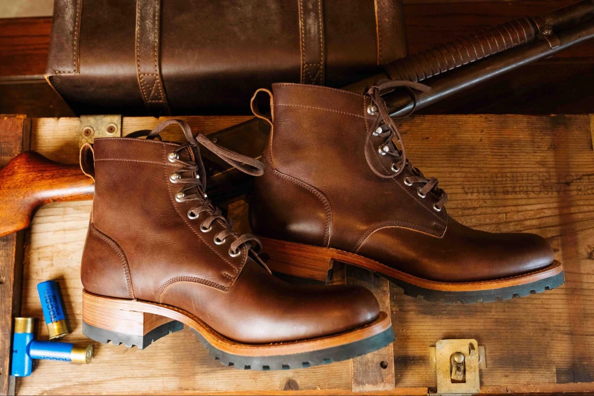 Pair of Dark Coffee Brown Huntsman Boots on a wooden crate