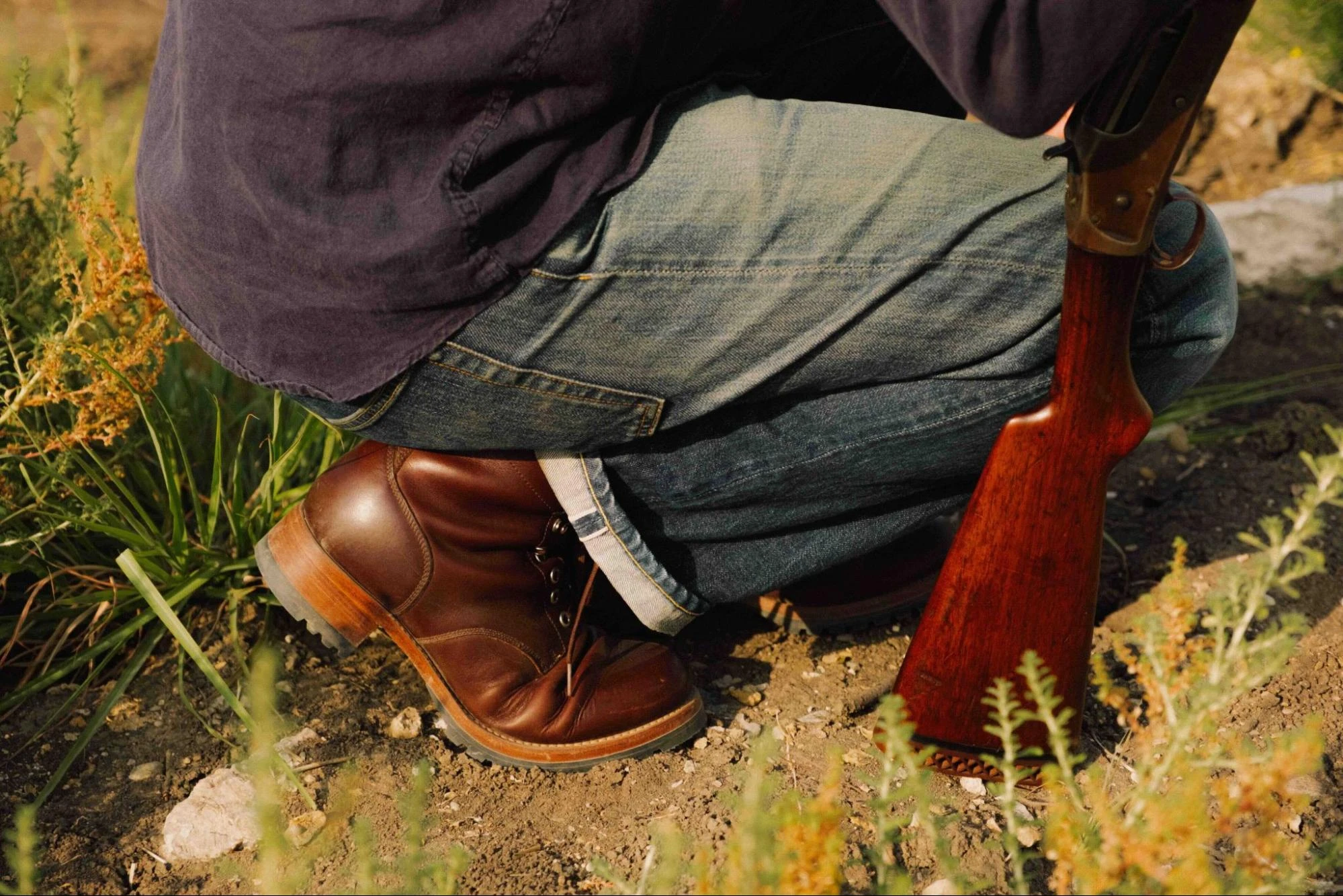 Kneeling outdoors in Dark Coffee Brown Huntsman Boots