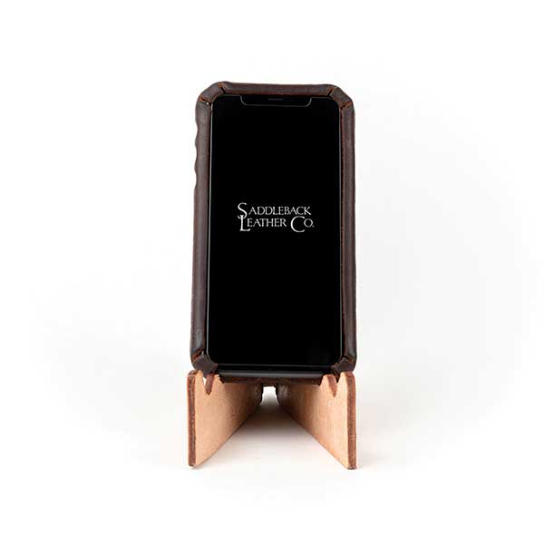 This is a leather iPhone stand that elevates your phone, so you can see the screen and not have to hold it.