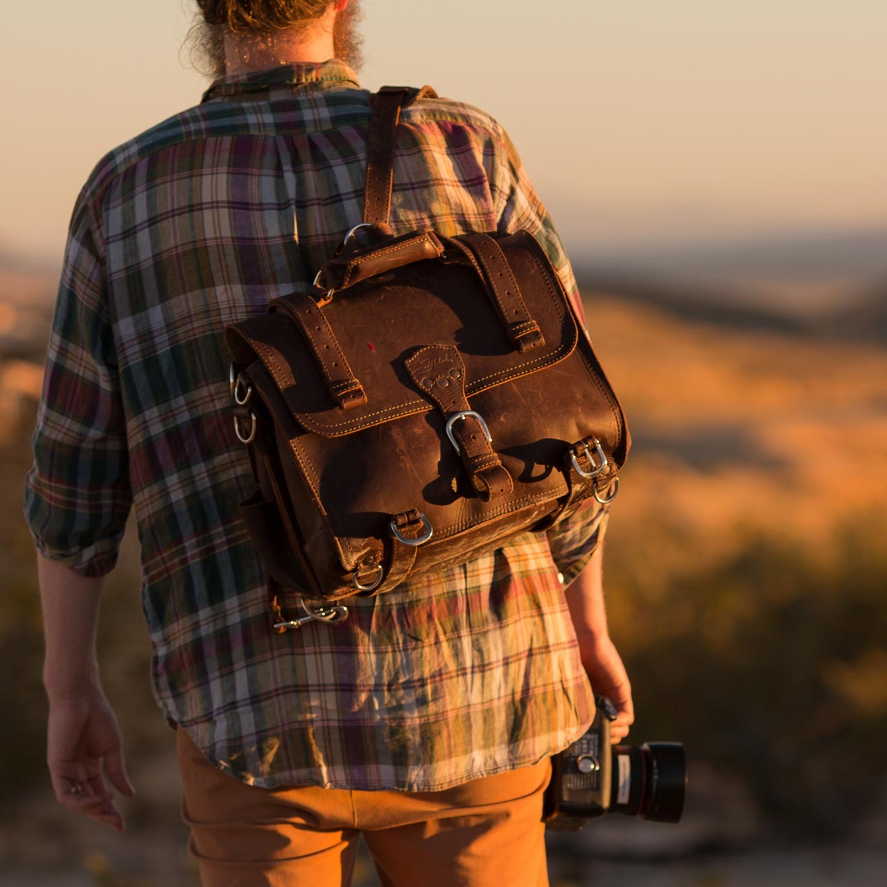 Leather briefcase that converts to backpack mode.