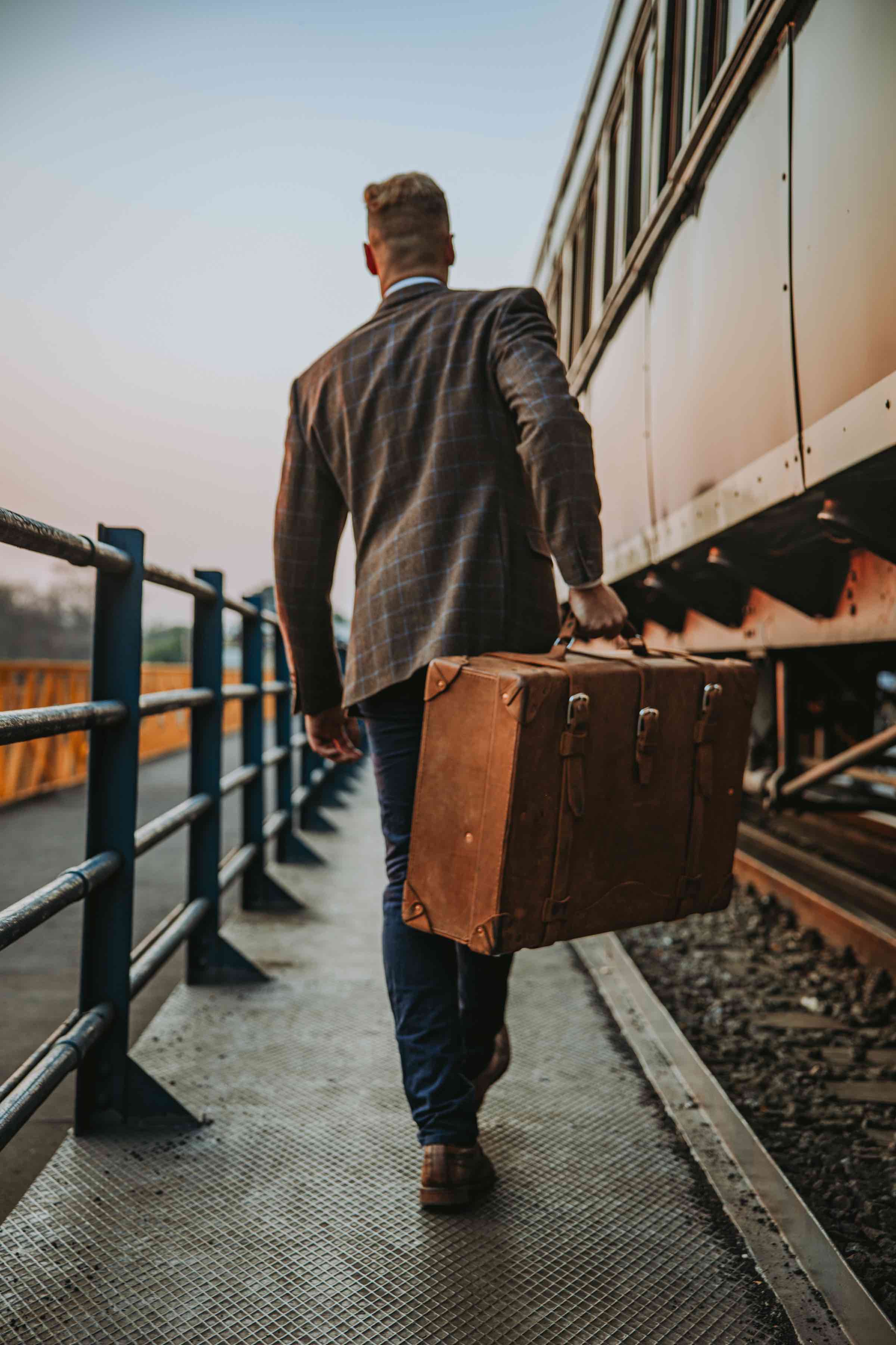 The leather suitcase is not lightweight, but it's not too heavy either. It has a balance that makes it challenging to fit 50 lbs. (23 kgs) into it. The interior is just one simple wide open space with two interior straps to hold clothes in place.