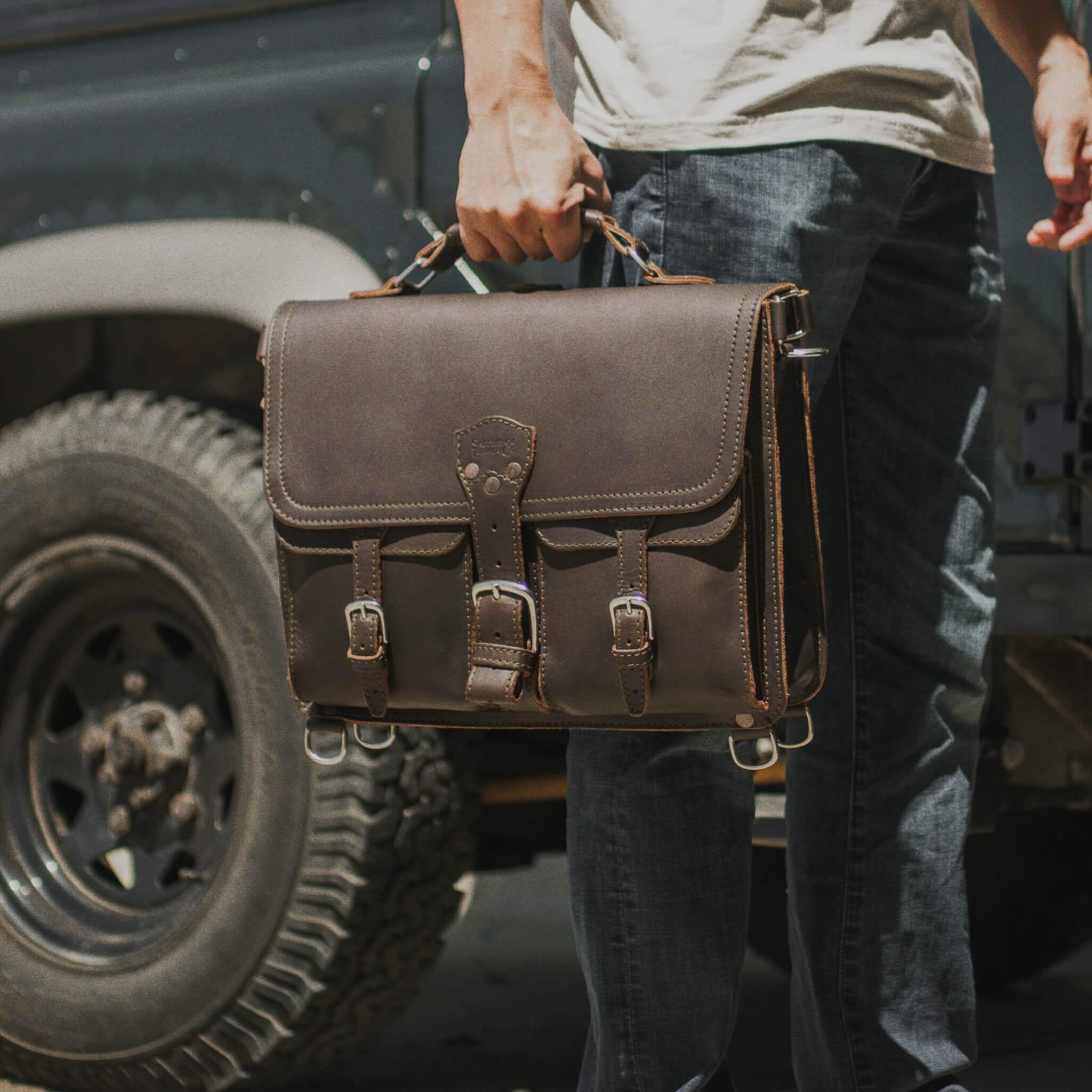 Full grain leather briefcase carried by hand.