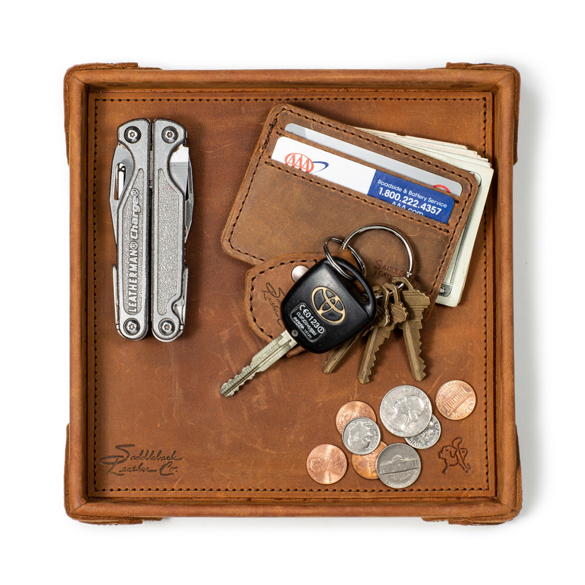 This leather catchall valet tray can hold a lot. Especially this tan brown one.