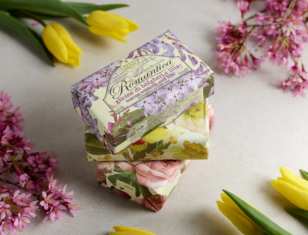 Nesti Dante floral soaps stacked up  with spring flowers around