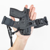 PHLster Enigma Micro in a person's hand, showing the front of the holster.
