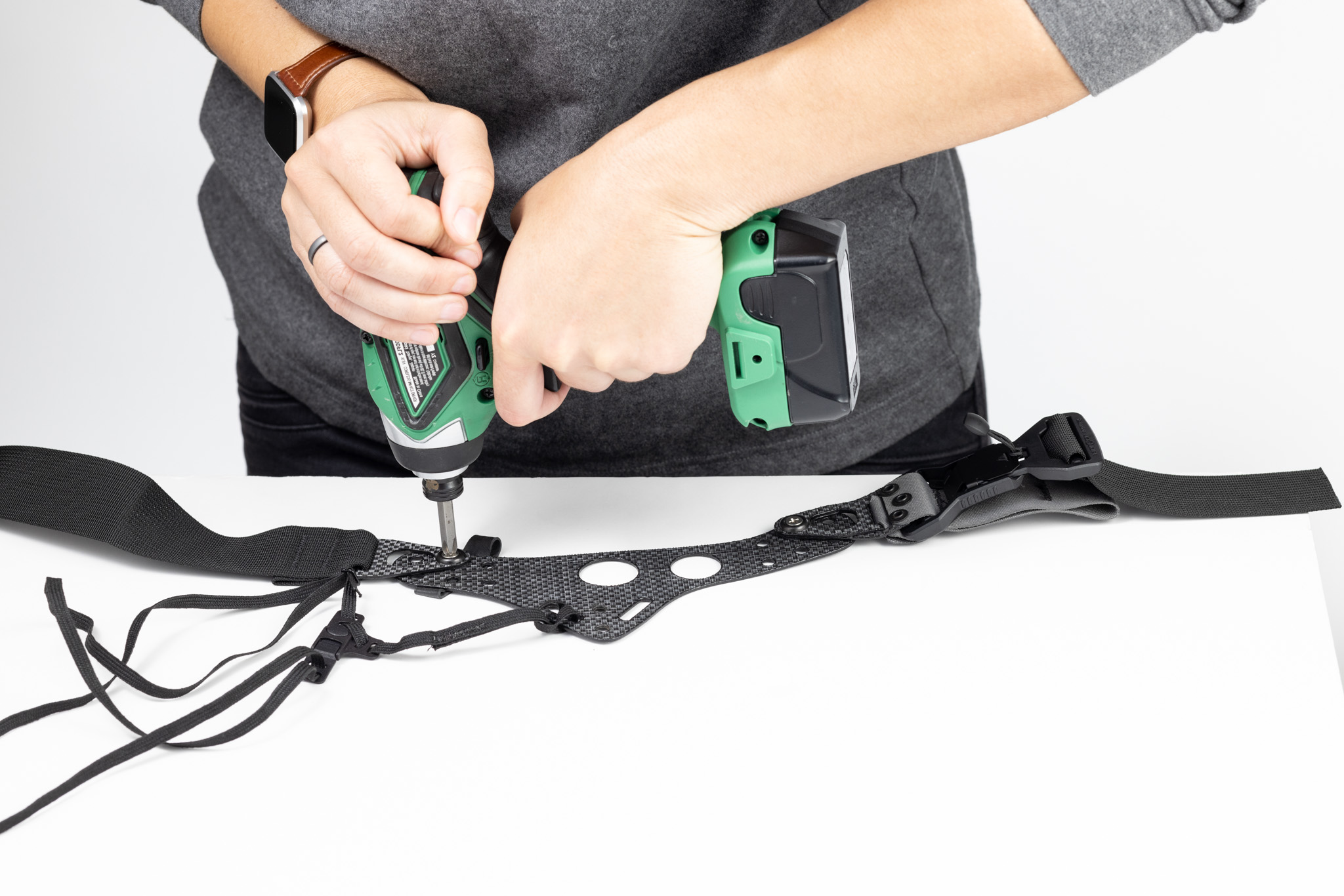 Photo of tightening Enigma screws with power screwdriver.