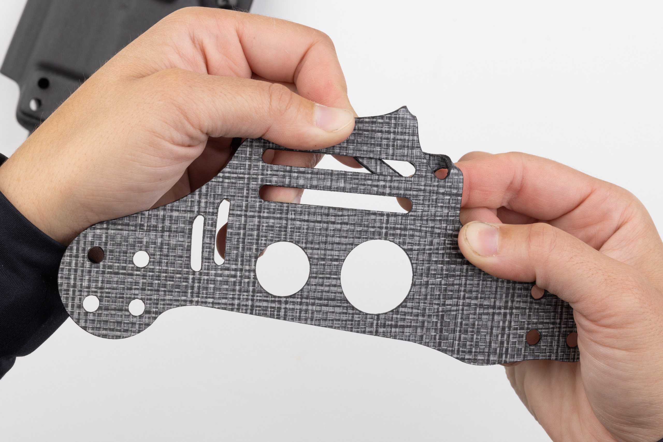 Photo of creasing flat the leg leash tab on Gen 1 Light Bearing Enigma.