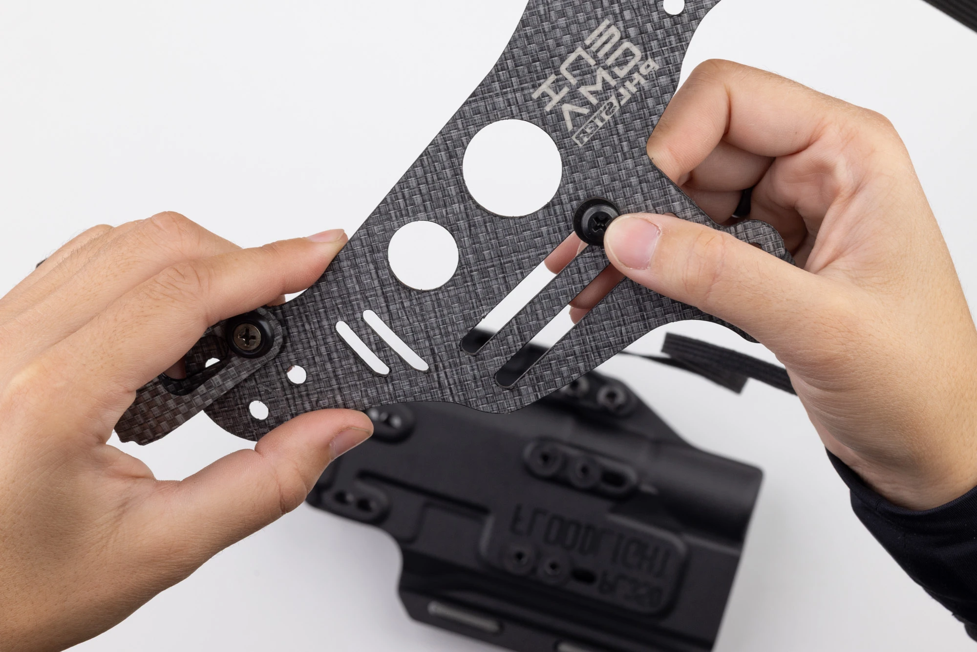 Photo of screw and washer on Light Bearing Enigma faceplate.