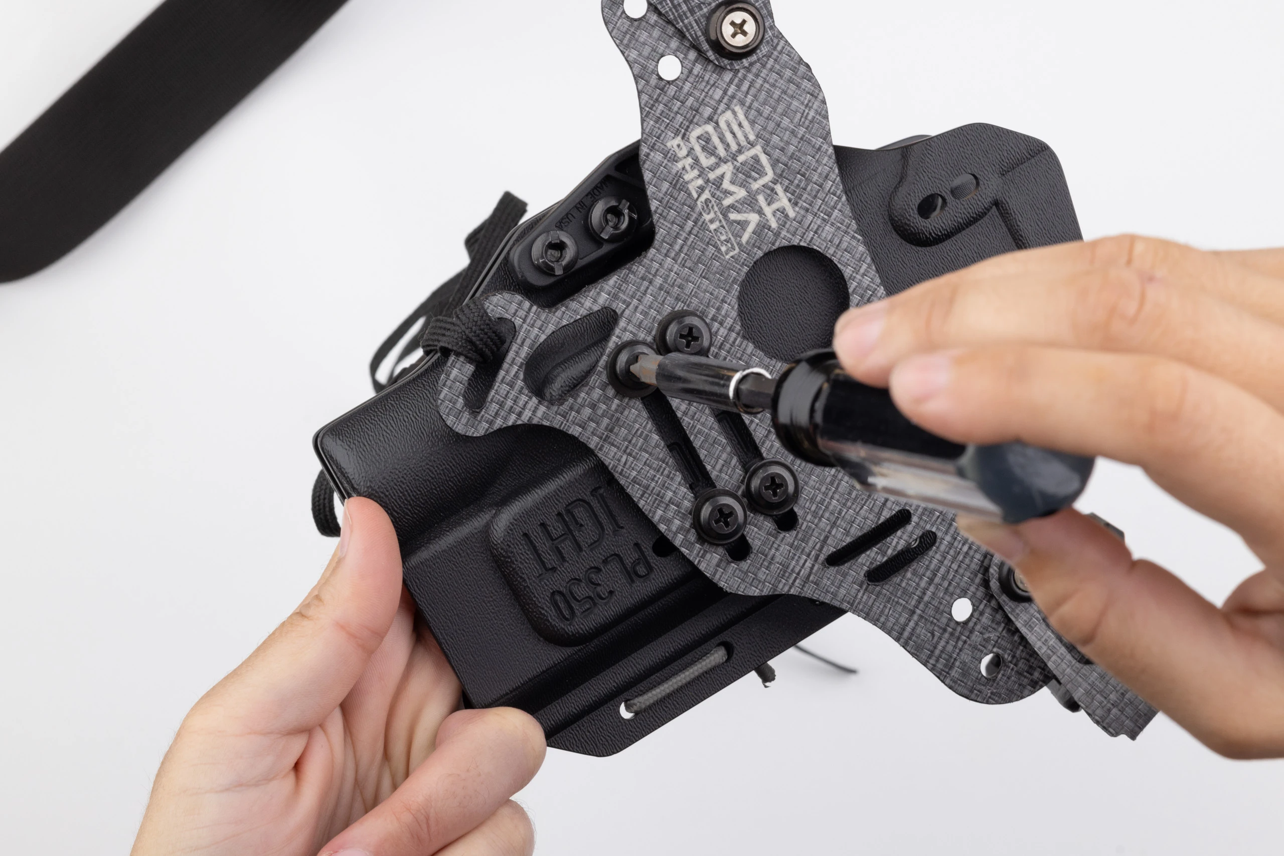 Photo of all four screws installed attaching holster to Enigma faceplate.