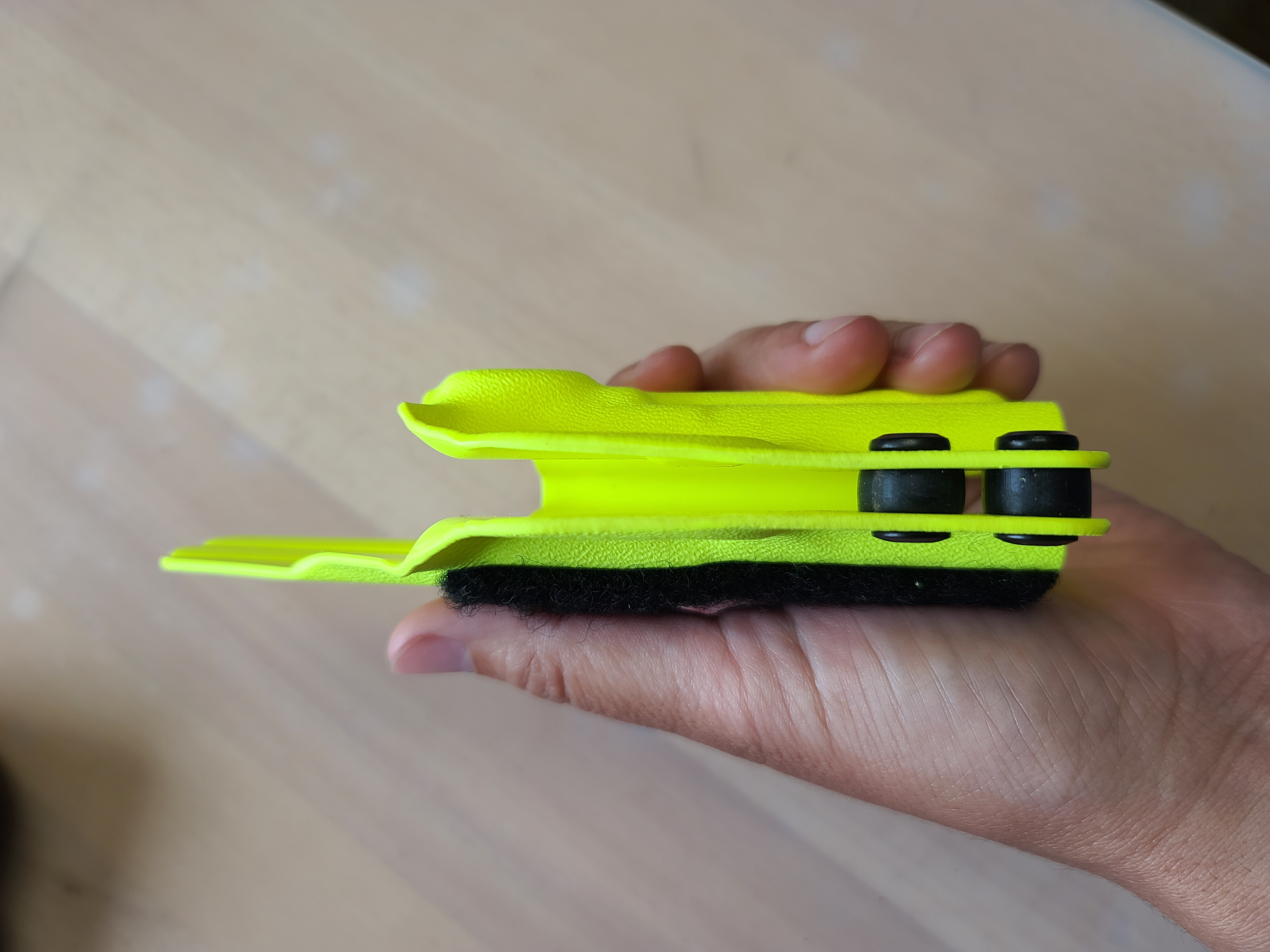 Photo of adjustable retention kydex holster with rubber retention washers between the two halves.