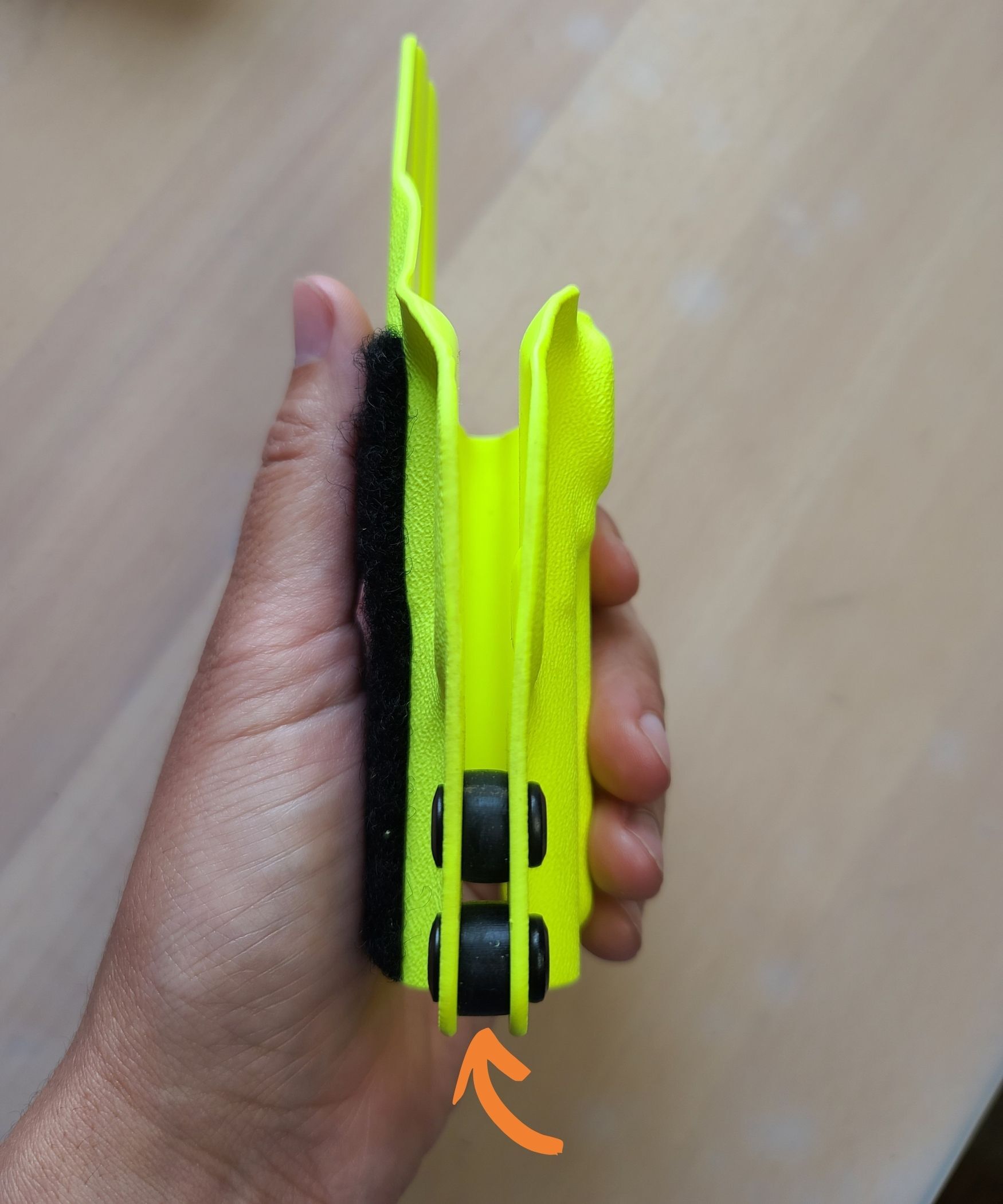 Adjustable retention holster - visible gap between halves with rubber washers