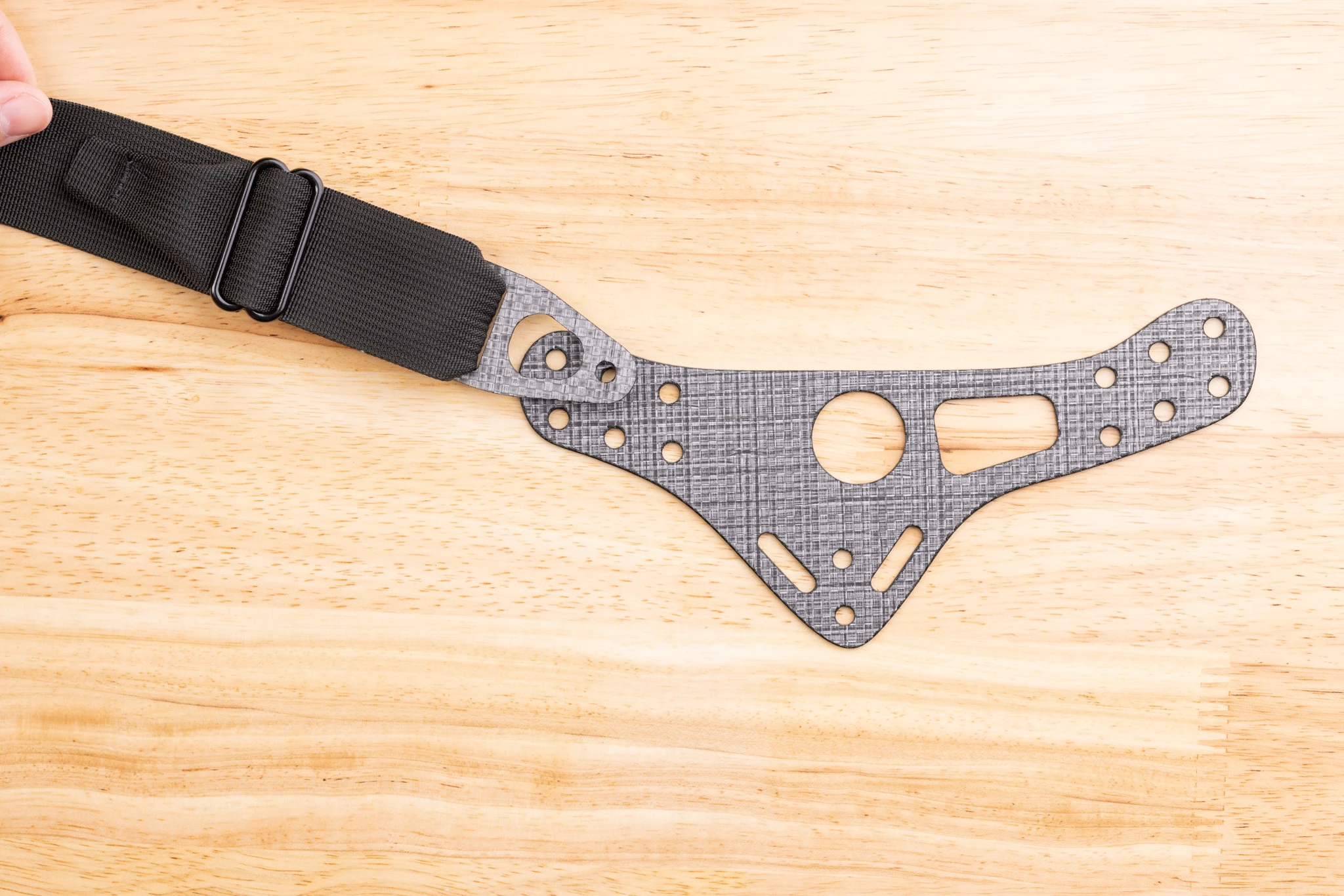 Photo comparison of correct vs incorrect belt end orientation.