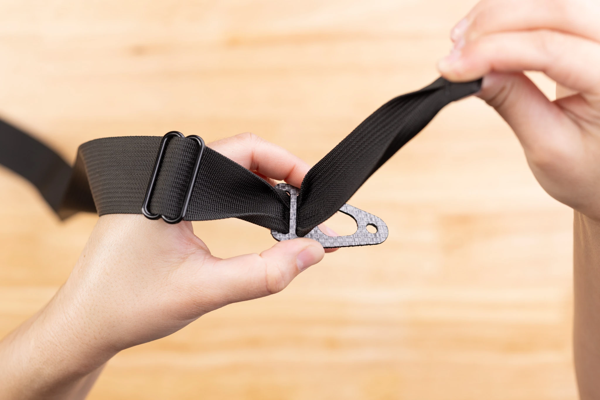 Photo of routing belt webbing through Enigma belt end.