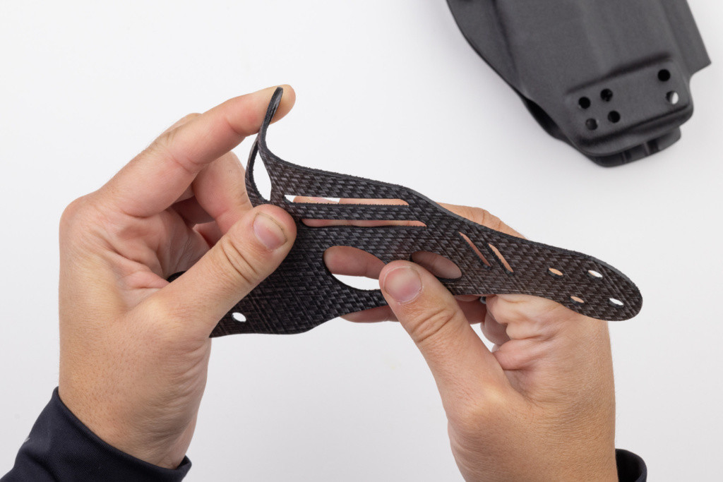 Photo of folding over the leg leash tab on Gen 1 Light Bearing Enigma.