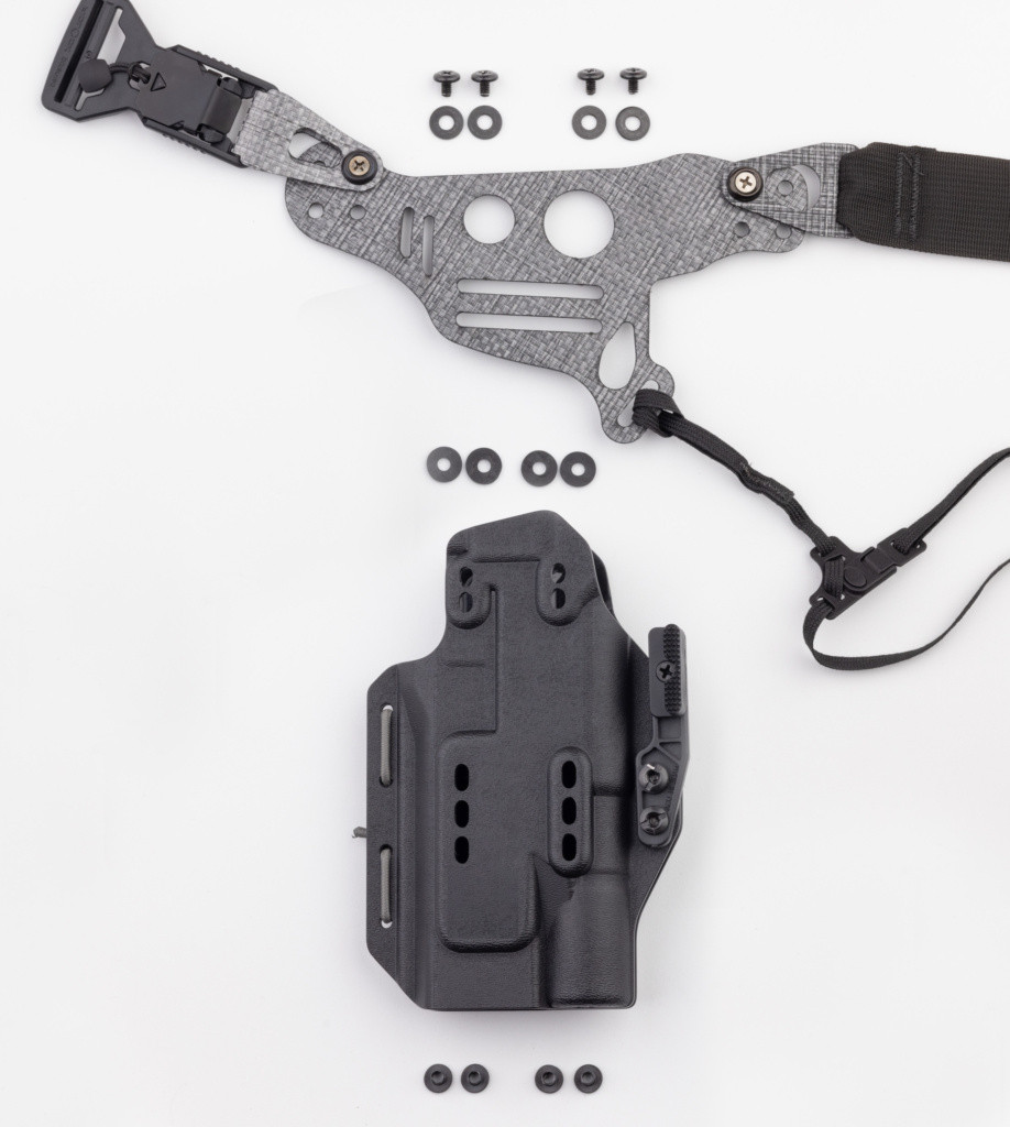 Photo of Light Bearing Enigma faceplate, holster, and holster hardware.